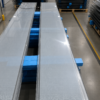 Large-format CdTe semi-transparent BIPV glass panels in production, ready for shipment
