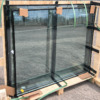 Commercial double-glazed glass units on a wooden transport rack