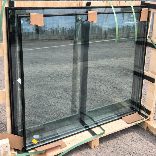 toughed double glazing Commercial double-glazed glass units on a wooden transport rack