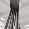 Upward view of curved sliding door tracks and aluminium frame