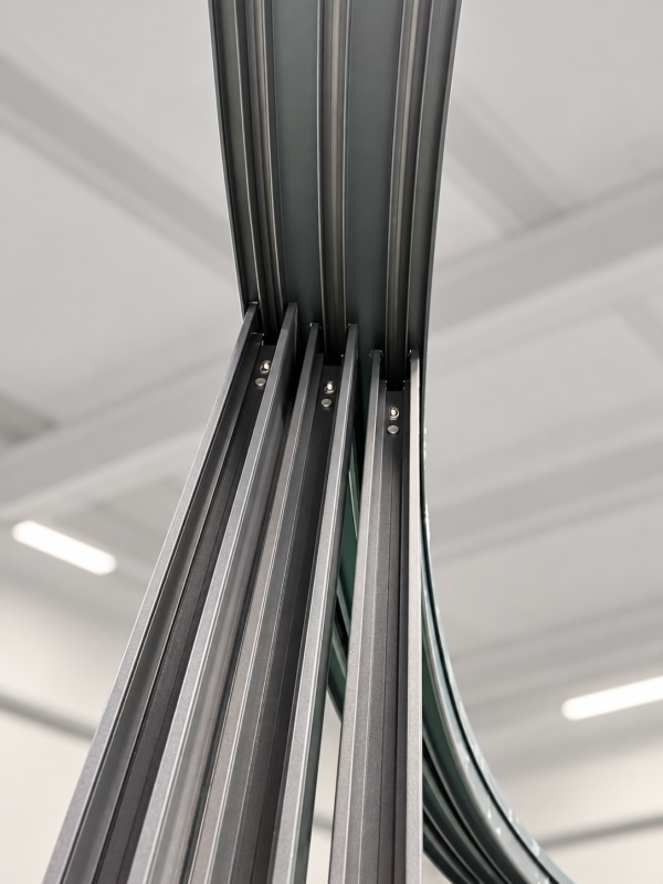 bespoke curved sliding doors Upward view of curved sliding door tracks and aluminium frame