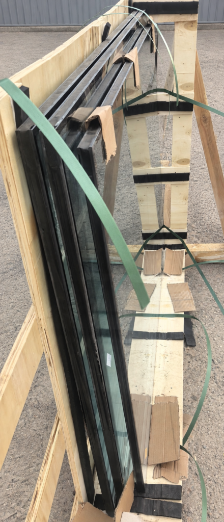 Insulating glass units supported in a wooden transport crate