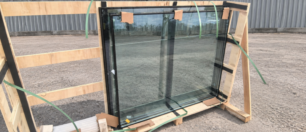 Insulating glass units supported in a wooden transport crate