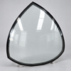 Bespoke petal-shaped laminated glass roof panel for a decorative ironwork pavilion