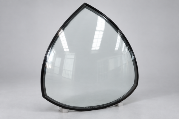 Bespoke petal-shaped laminated glass roof panel for a decorative ironwork pavilion