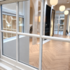 Detail of painted timber sash joinery and glazing bars