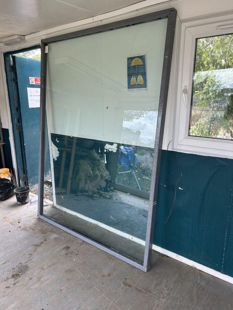 A vacuum glass panel ready for installation during the conversion